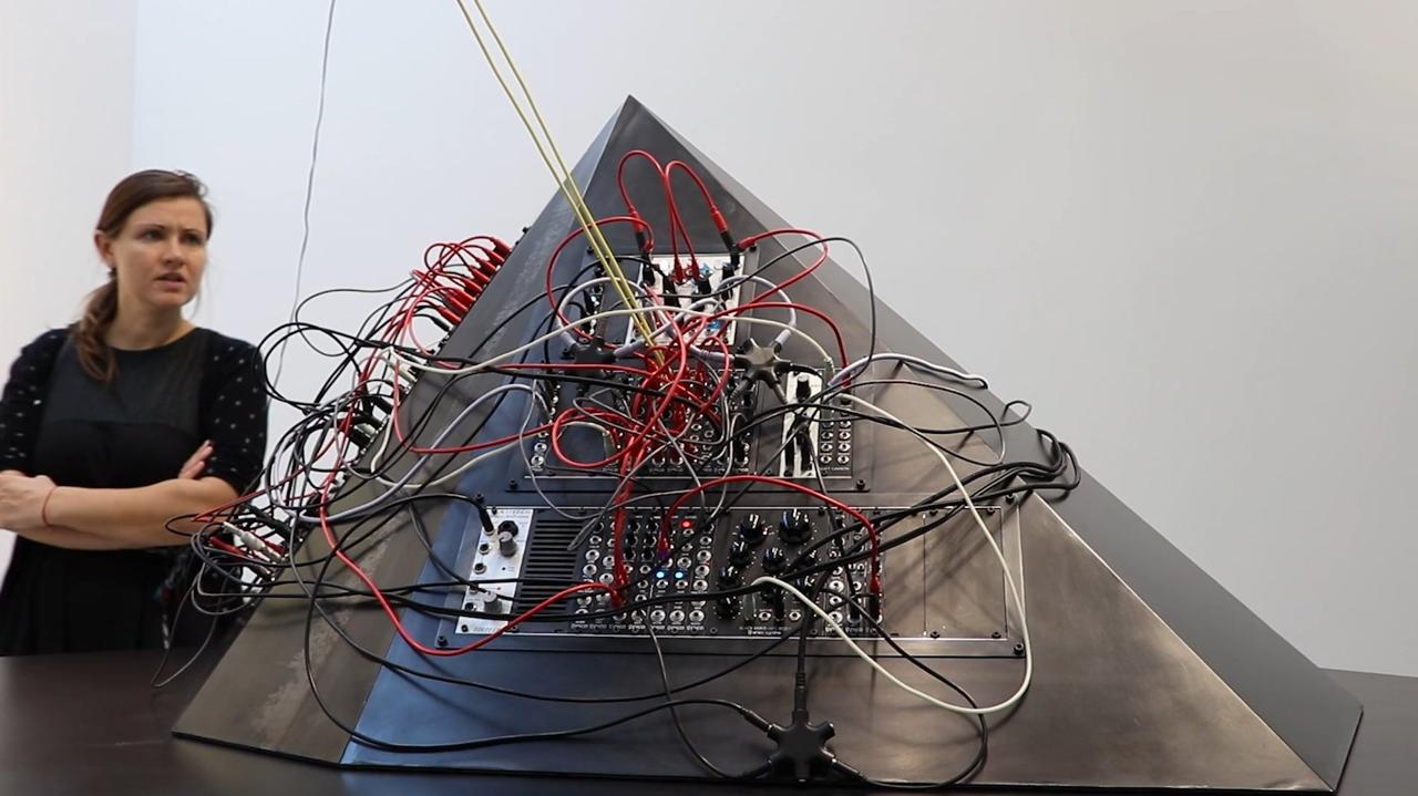 Modular synthesizer mounted on a steel pyramid sculpture